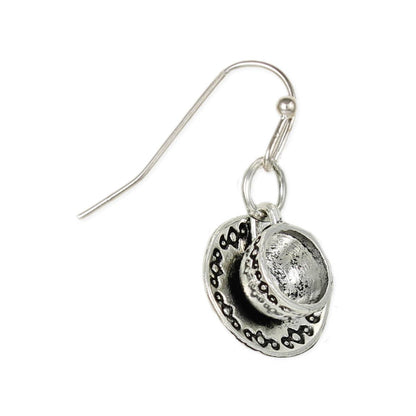 Silver earring with intricate design on a white background